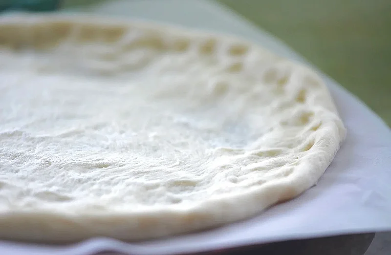 rolled out pizza dough