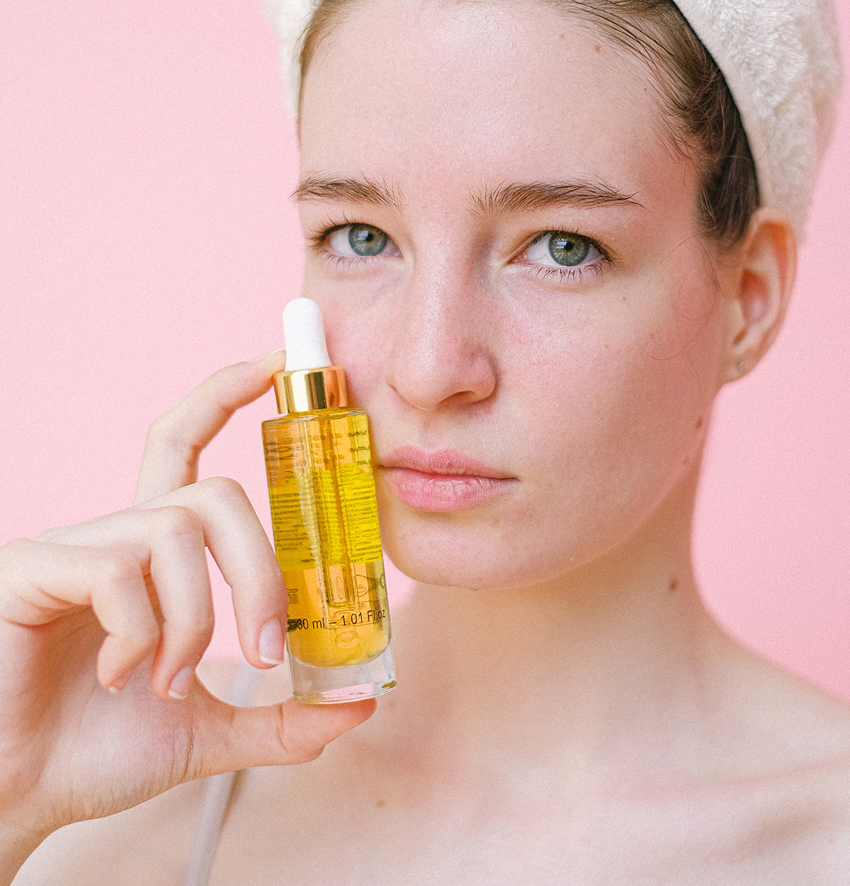 Woman holding an oil cleanser