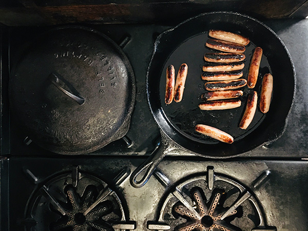 Cooking sausages on a skillet